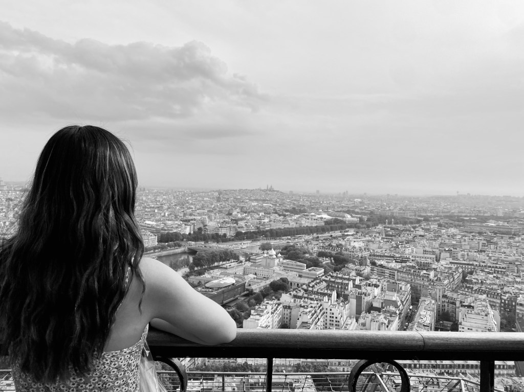 Me looking out over Paris from the Eiffel Tower's 2nd level observation deck.